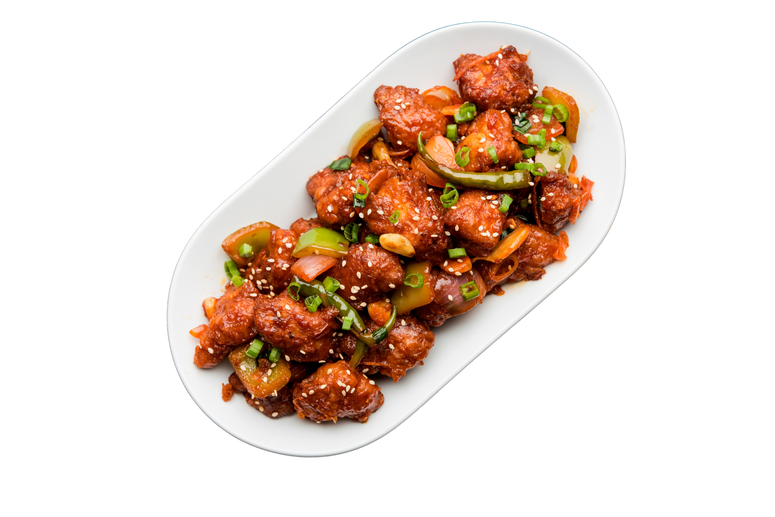 Hotel Daawat Chilli Chicken, a dish of cooked with chicken coated in corn flour and vegetables such as onion, capsicum on a white plate